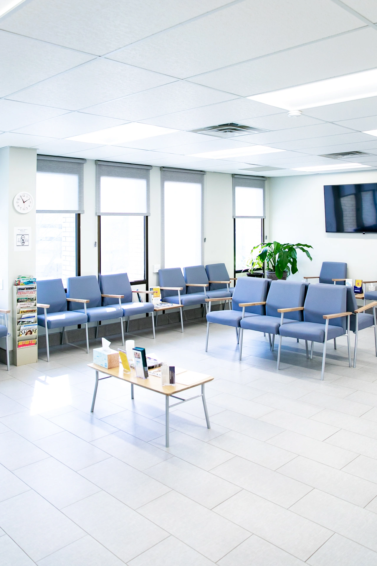 The Rockland Beauty waiting room in daylight, with rows of chairs and a low table